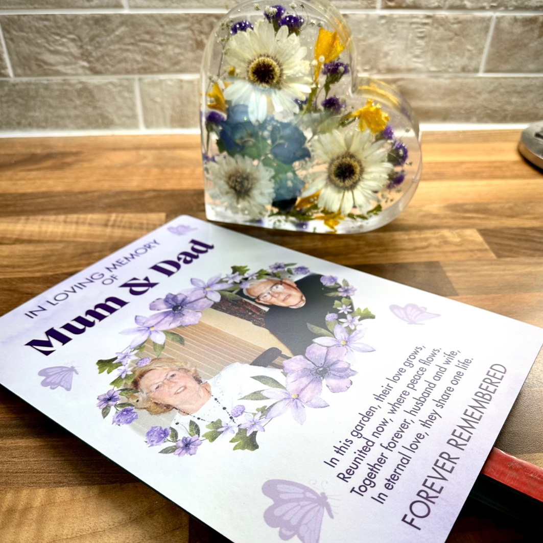 Memorial plaque and resin heart containing preserved funeral flowers, designed as a package to honour loved ones. The plaque, featuring a photo and poem and the resin heart will be placed in a memorial garden. Created by Orchid Memories