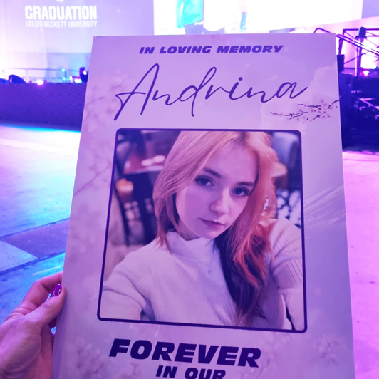 A photo memory board created in honour of Andrina, featuring her image and personal elements, designed for her mother to display during her graduation ceremony as a heartfelt tribute, symbolising the presence of her daughter on this significant day. Created by Orchid Memories