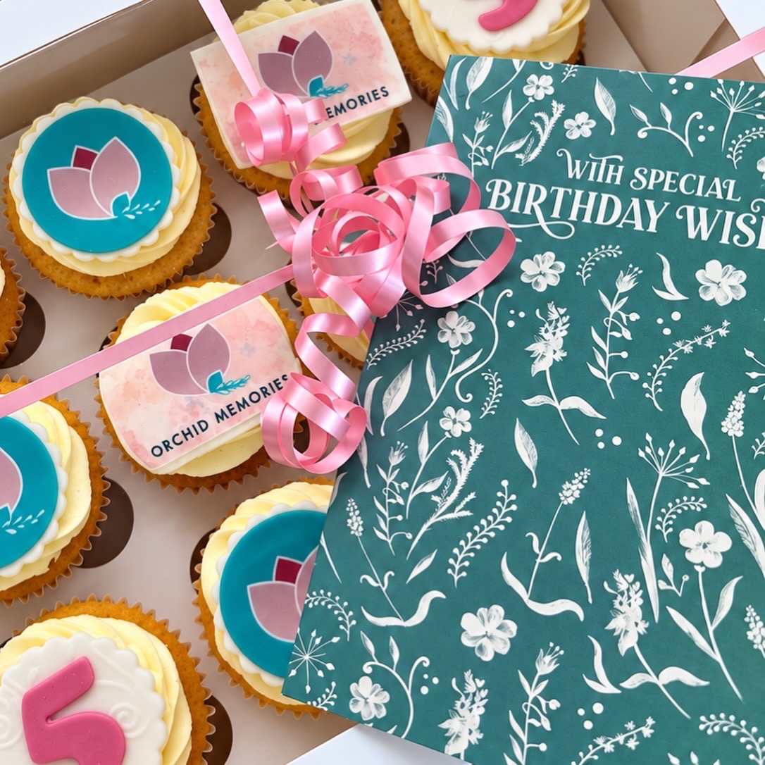 Birthday card and cupcakes featuring the Orchid Memories logo, celebrating five years in business.
